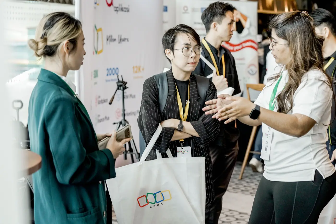 An Ooroboros engineer talking two attendees through the work at Zoholics APAC